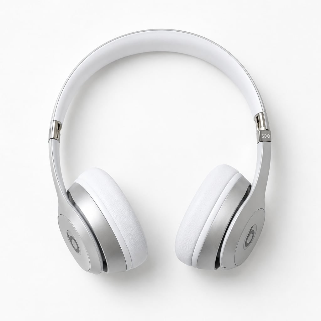 Silver over-ear headphones on a white background